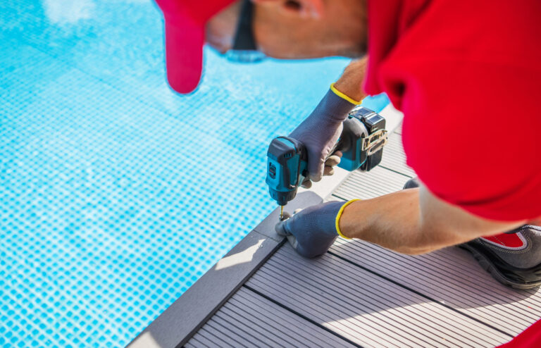 Composite deck building near a pool, home improvement and maintenance project